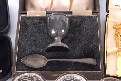 Lot 200 - A cased George V silver egg cup and spoon,...