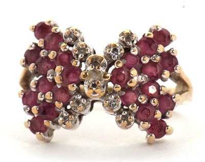 Lot 2 - A 9ct ruby and diamond bow ring, the bow set...