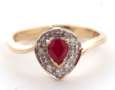 Lot 6 - A 9ct ruby and diamond ring, the central pear...