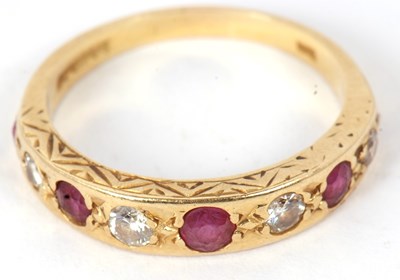 Lot 11 - A 9ct ruby and diamond ring, set with...