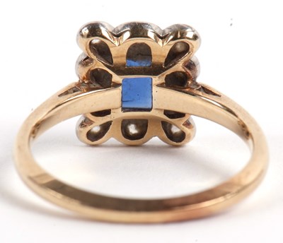 Lot 22 - A sapphire and diamond ring, the central...