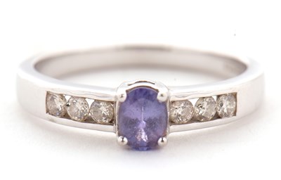 Lot 4 - A 9ct tanzanite and diamond ring, the central...