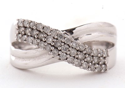 Lot 7 - A 9kt diamond crossover ring, with three...