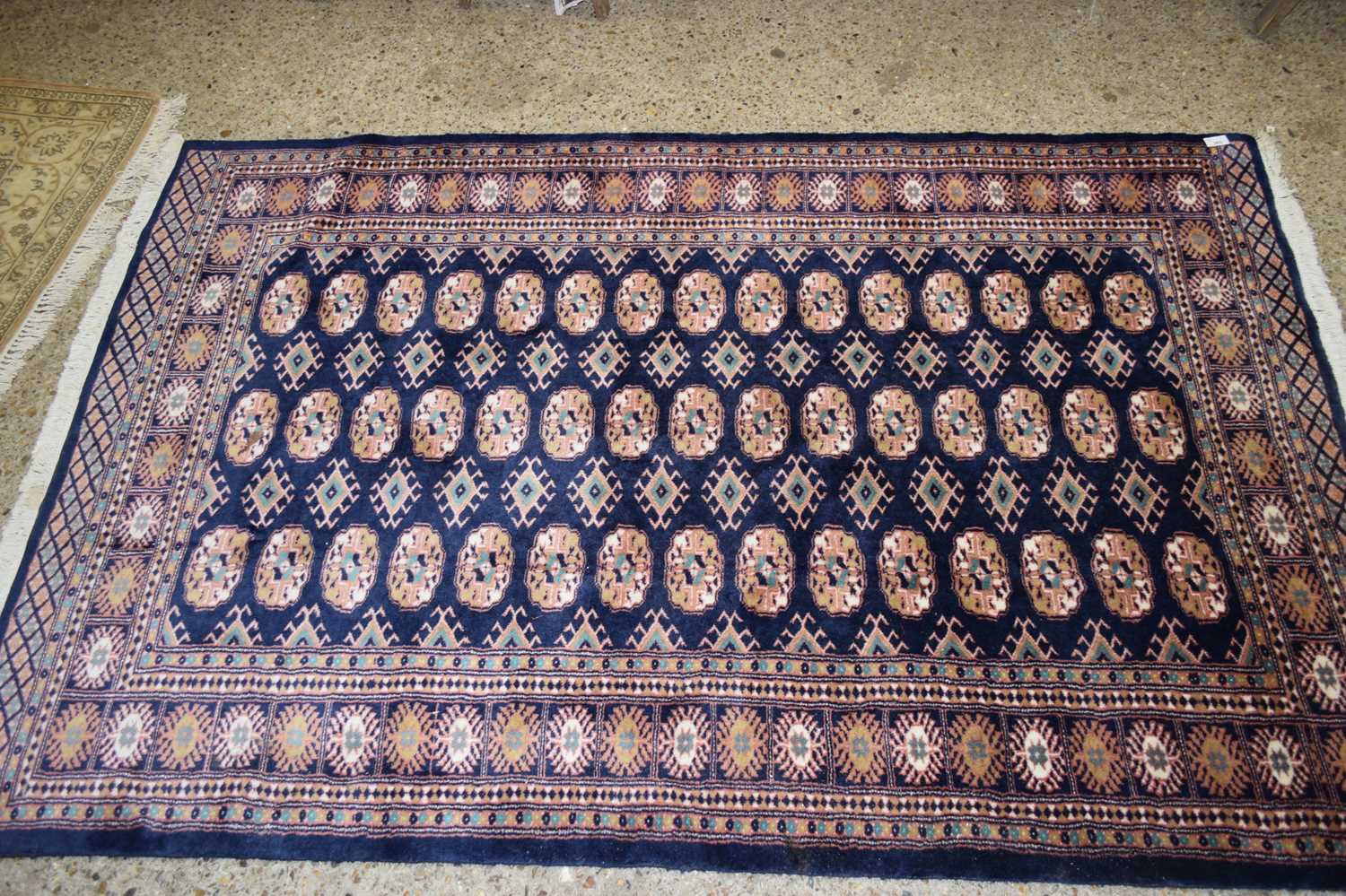 Lot 365 - 20TH CENTURY FLOOR RUG DECORATED WITH LOZENGES...