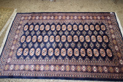 Lot 365 - 20TH CENTURY FLOOR RUG DECORATED WITH LOZENGES...