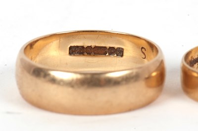 Lot 87 - Three gold rings: to include a 22ct wedding...