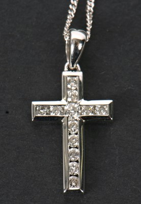 Lot 63 - An 18ct and diamond cross and chain, the cross...