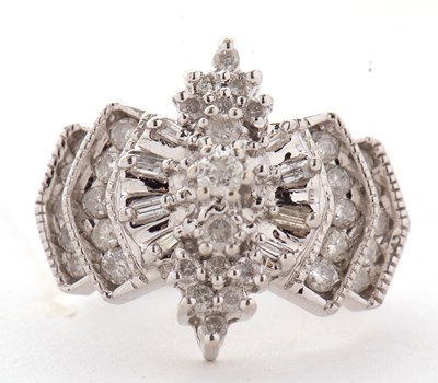 Lot 17 - A 14ct diamond ring, the Odeonesque style ring...