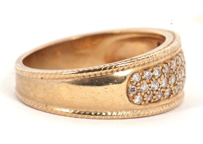 Lot 10 - A 9ct diamond ring, the 8mm wide band set with...