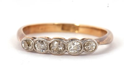 Lot 15 - A five stone diamond ring, the five slightly...