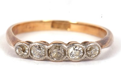 Lot 15 - A five stone diamond ring, the five slightly...