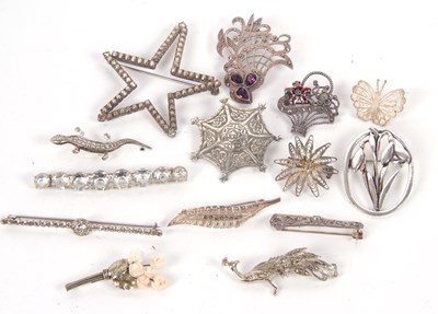 Lot 129 - A group of silver and white metal brooches, to...