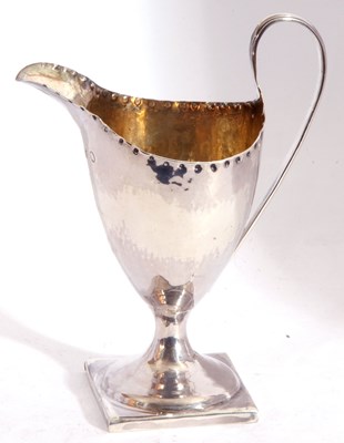 Lot 10 - George III silver pedestal cream jug of helmet...