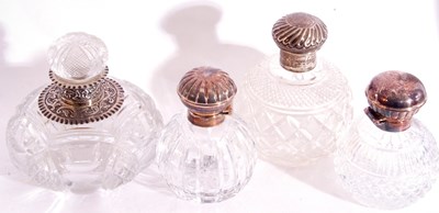 Lot 16 - Group of four cut glass table scent bottles to...
