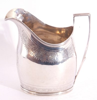 Lot 27 - George III silver cream jug of helmet shape,...