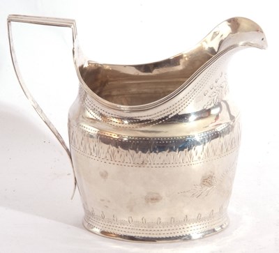 Lot 31 - George III cream jug of helmet shape, the body...