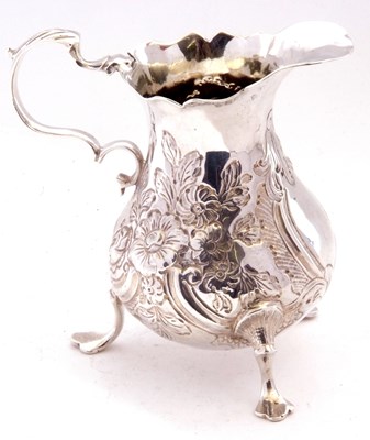 Lot 36 - George III cream jug of baluster form, the...