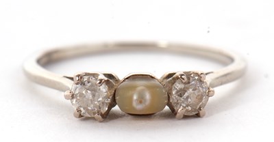 Lot 29 - A diamond and 'pearl' ring, the central...