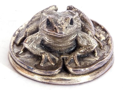 Lot 56 - Elizabeth II silver resin filled frog and lily...