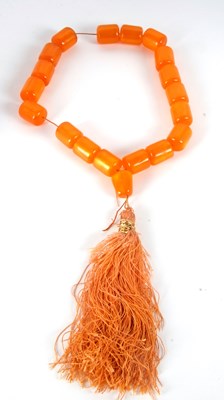 Lot 153 - A faux amber bead necklace, the barrel shape...