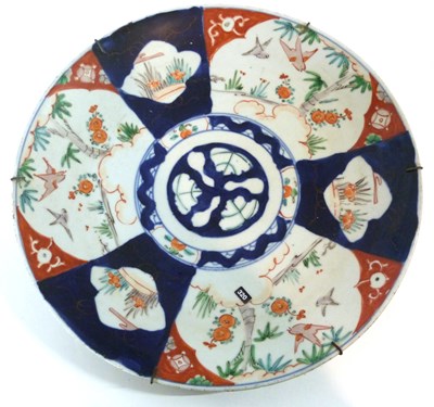 Lot 316 - A Japanese porcelain charger with a Kakiemon...