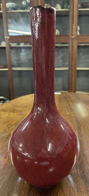 Lot 313 - A Chinese flambe bottle vase, in a sdb glaze,...