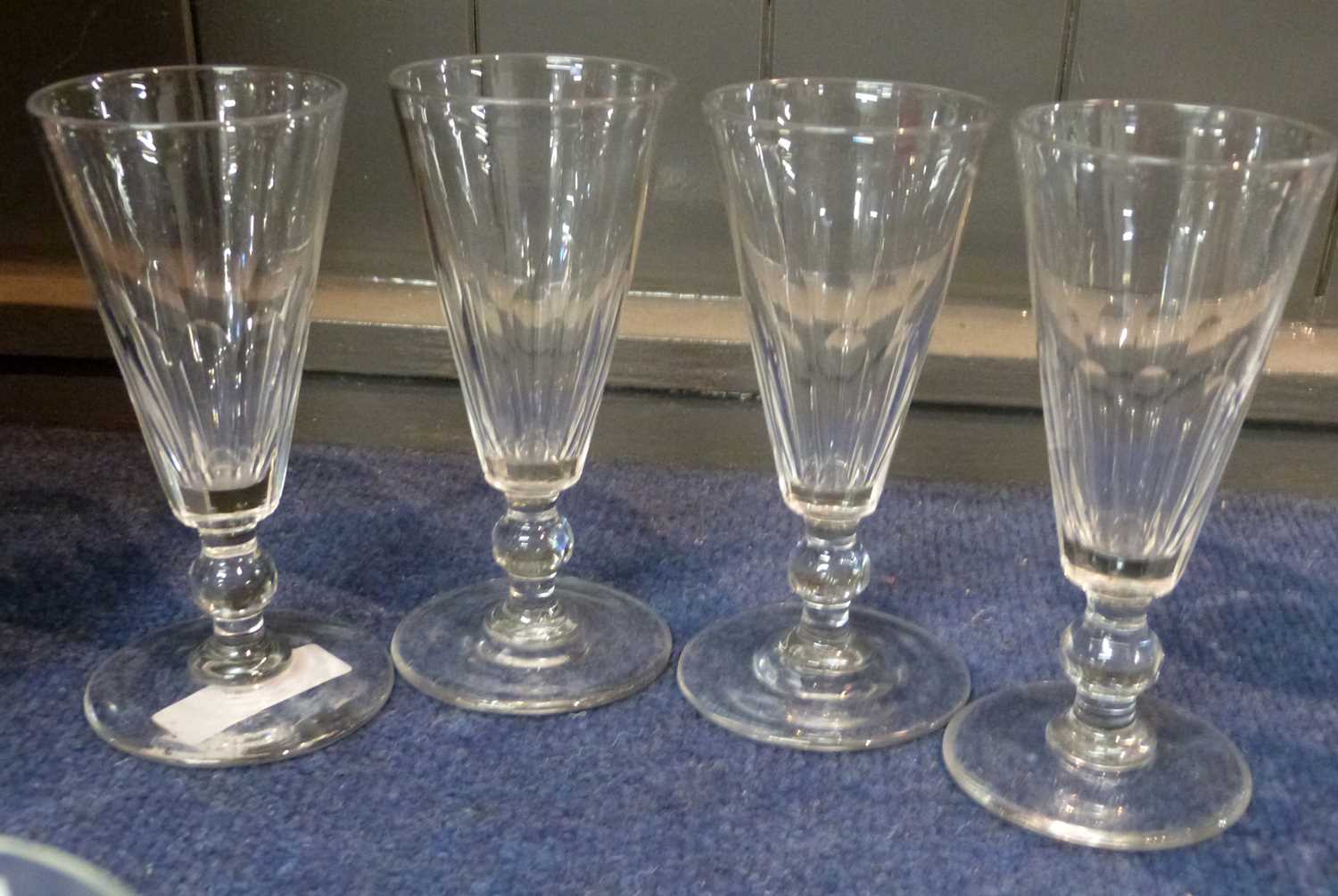 Lot 305 - A set of four 19th Century champagne glasses...