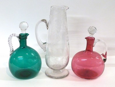Lot 307 - Two decanters, one green glass the other...