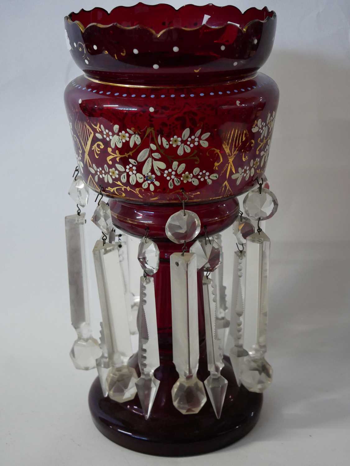 Lot 295 - A cranberry glass table lustre with painted...