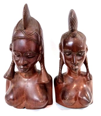 Lot 327 - A pair of carved Ethnographica heads of a man...