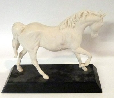 Lot 341 - A Beswick model of a horse on rectangular...