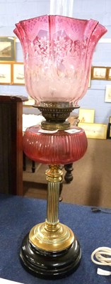 Lot 369 - A 19th Century oil lamp, the brass Corinthian...