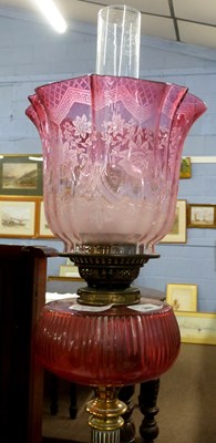 Lot 369 - A 19th Century oil lamp, the brass Corinthian...