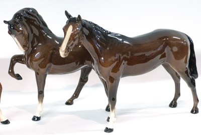 Lot 404 - A group of four Beswick horses (one with leg a/f)