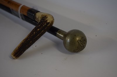 Lot 488 - Base metal topped swagger stick together with...