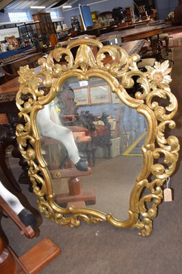 Lot 502 - A Georgian style gilt wood wall mirror with...