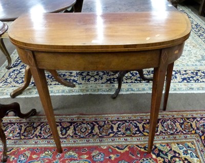 Lot 506 - A Georgian faded mahogany D shaped tea table...