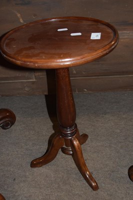 Lot 514 - A 20th Century mahogany wine table with tripod...