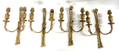 Lot 535 - A set of four early 20th Century gilt brass...