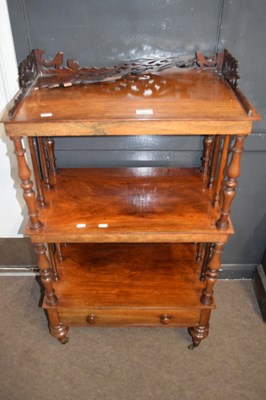 Lot 583 - A Victorian three tier rosewood what not with...