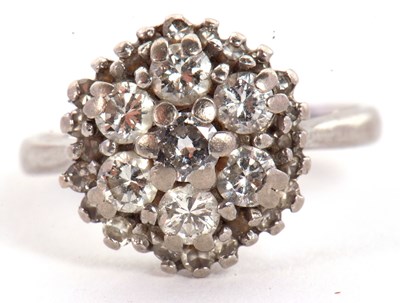 Lot 75 - An 18ct diamond cluster ring, the round...