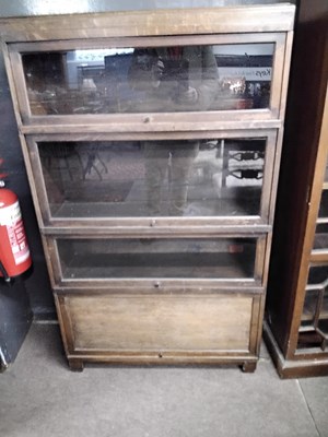 Lot 636 - A Globe Wernicke four tier stacking bookcase,...