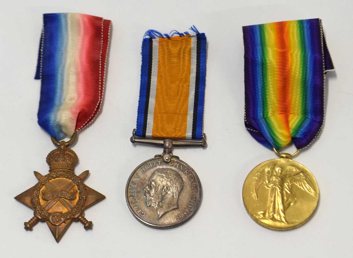 Lot 76 - First world war British medal group of three...