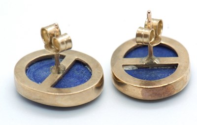 Lot 97 - A pair of lapis lazuli earstuds, the oval...