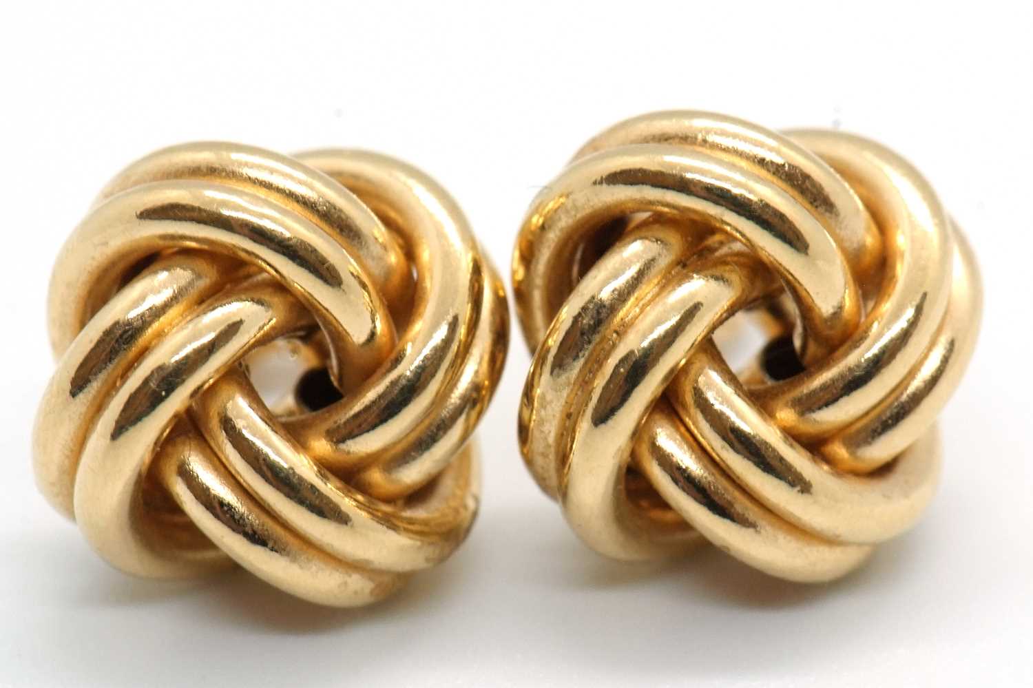 Lot 90 - A pair of 18ct knot style earrings, approx....