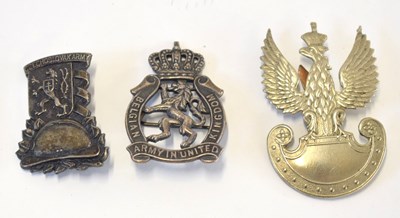 Lot 186 - Three European military cap badges to include...