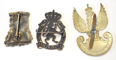 Lot 186 - Three European military cap badges to include...