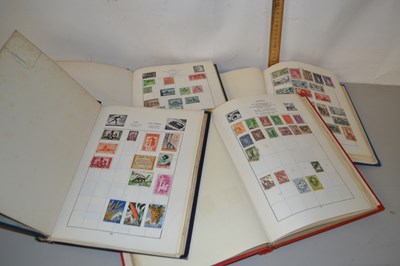 Lot 1 - Four albums containing a junior world stamp...