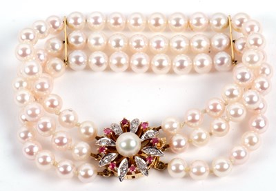 Lot 100 - An 18ct cultured pearl, ruby and diamond...