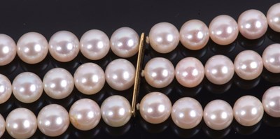 Lot 100 - An 18ct cultured pearl, ruby and diamond...